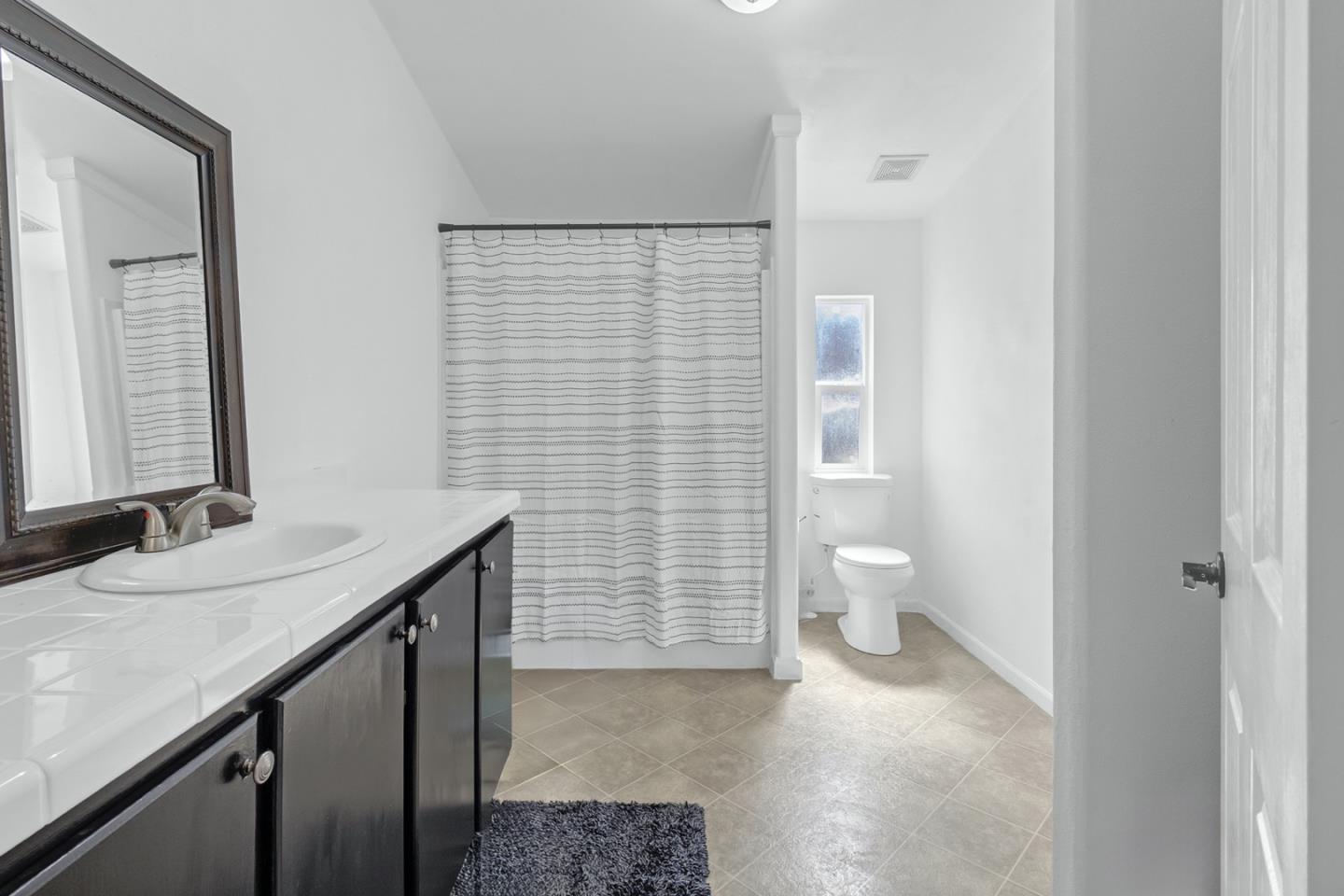 1900 Highway 1, Unit 62 Moss Landing, CA 95039 - Photo 14 of 21 a bathroom with a sink a toilet and shower