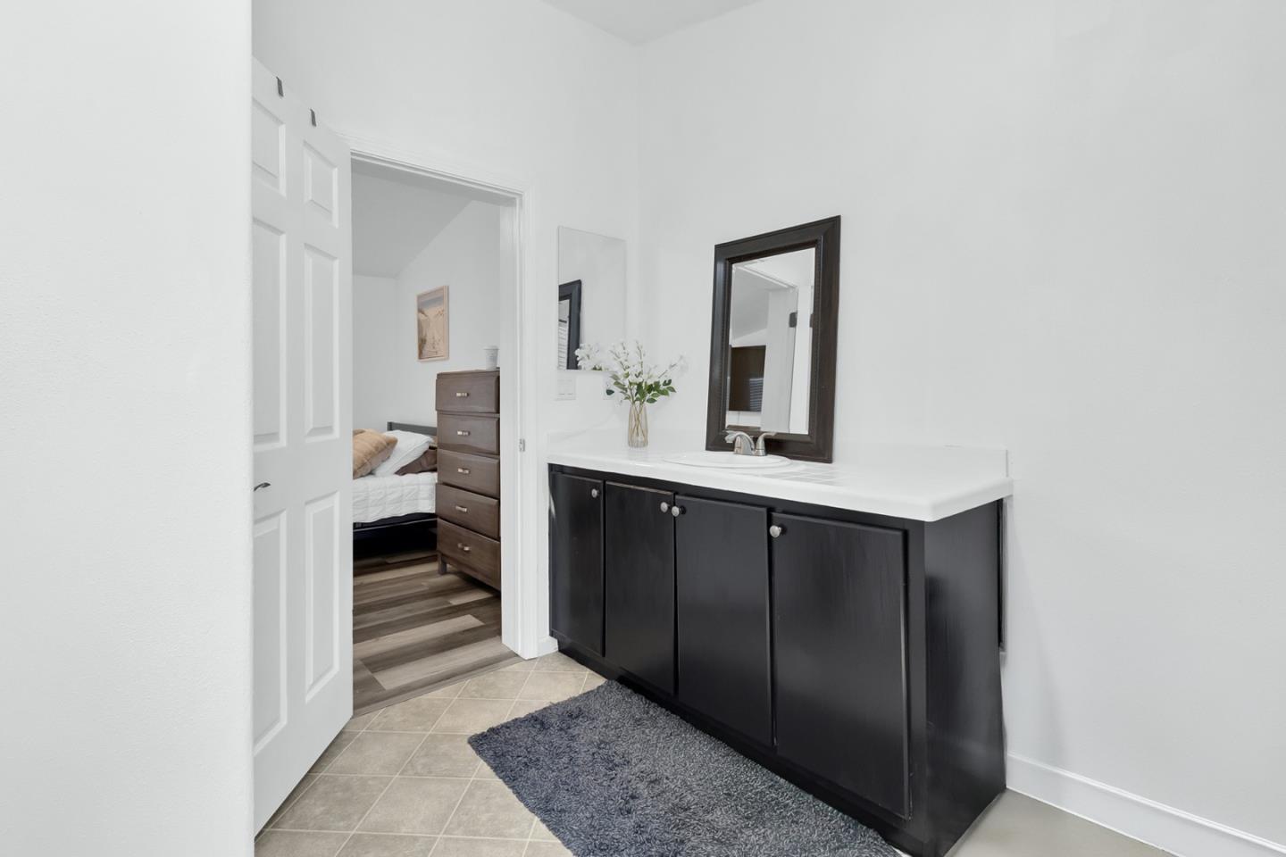 1900 Highway 1, Unit 62 Moss Landing, CA 95039 - Photo 15 of 21 a bathroom with a sink and a mirror
