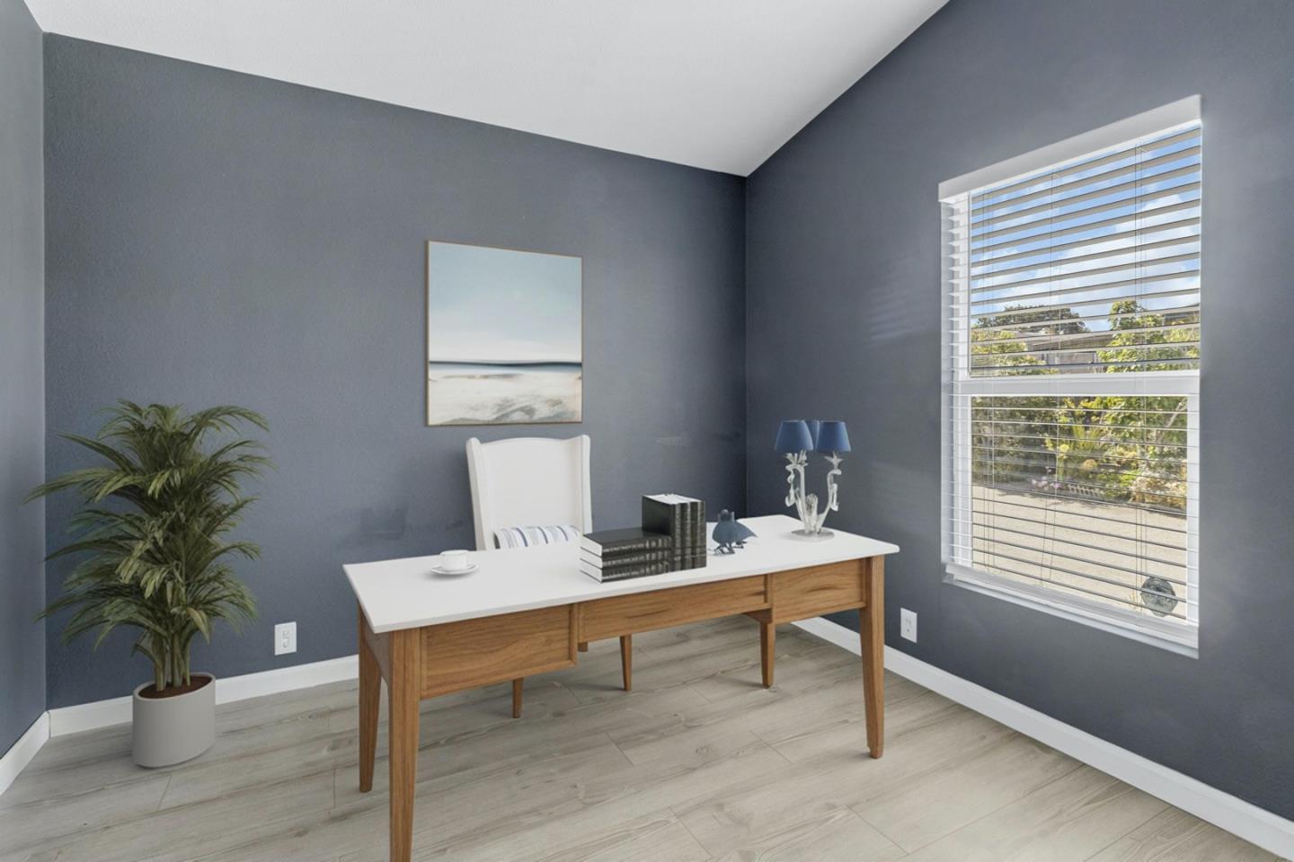 1900 Highway 1, Unit 62 Moss Landing, CA 95039 - Photo 18 of 21 a workspace with furniture and a potted plant