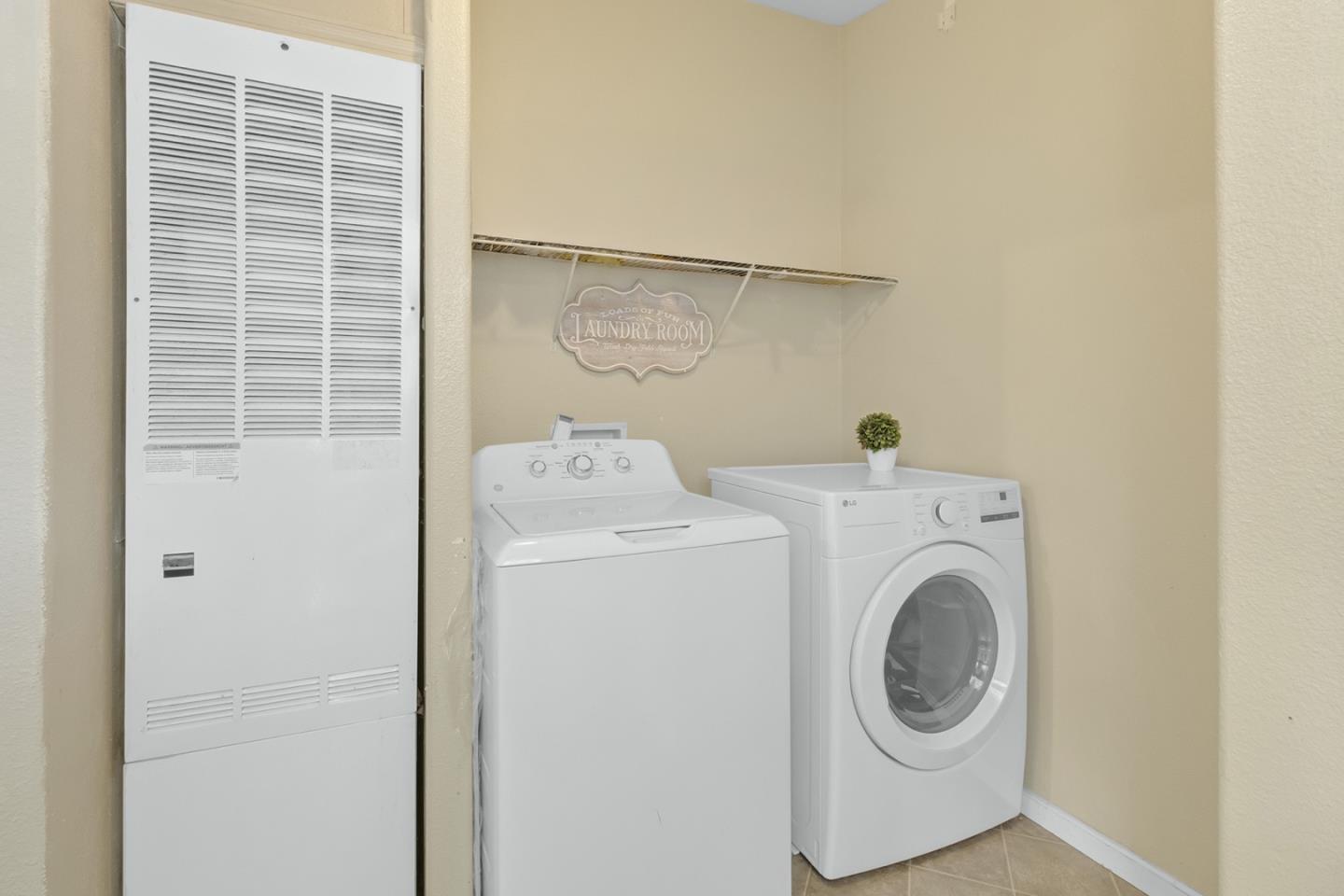 1900 Highway 1, Unit 62 Moss Landing, CA 95039 - Photo 19 of 21 a utility room with dryer and washer