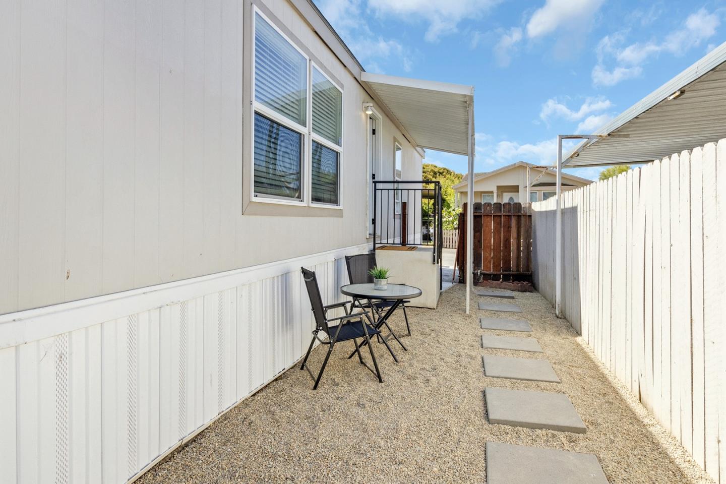 1900 Highway 1, Unit 62 Moss Landing, CA 95039 - Photo 3 of 21 a view of a patio with a table and chairs
