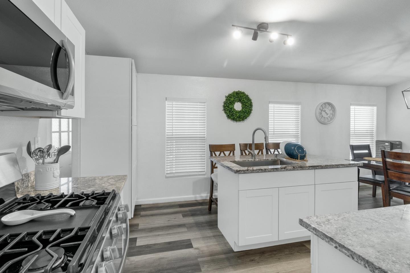 1900 Highway 1, Unit 62 Moss Landing, CA 95039 - Photo 6 of 21 a kitchen with stainless steel appliances granite countertop a stove and a sink