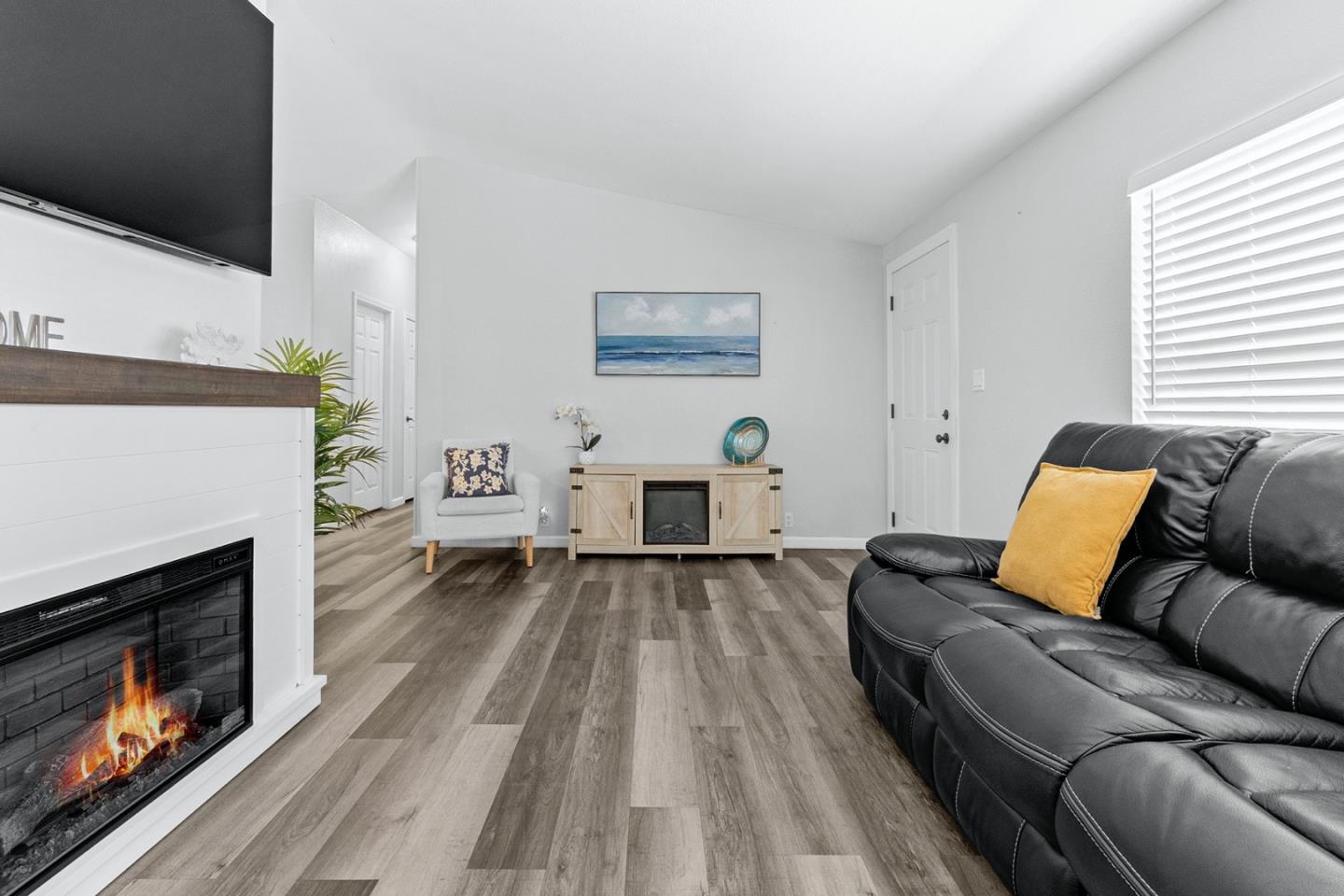 1900 Highway 1, Unit 62 Moss Landing, CA 95039 - Photo 8 of 21 a living room with furniture and a fireplace
