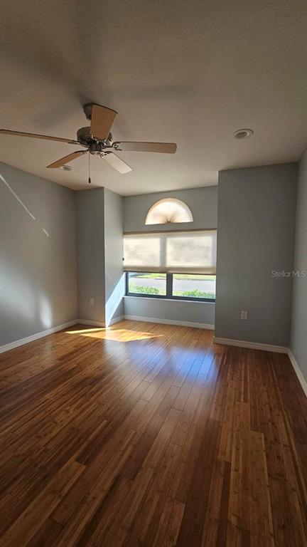 882 Lucas Lane Oldsmar, FL 34677 - Photo 15 of 27 wooden floor in an empty room with a window