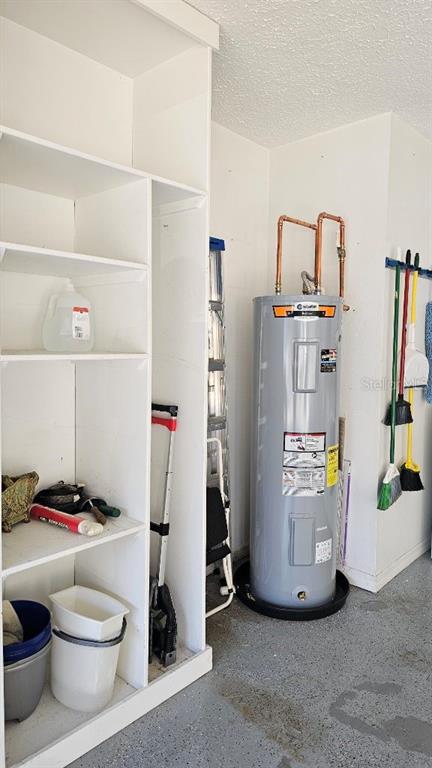 882 Lucas Lane Oldsmar, FL 34677 - Photo 26 of 27 a view of walk in closet with clothes and shoes