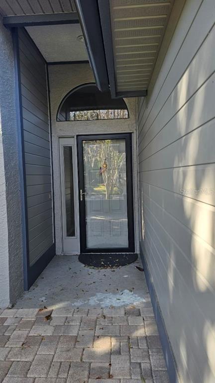 882 Lucas Lane Oldsmar, FL 34677 - Photo 4 of 27 a view of a car garage door