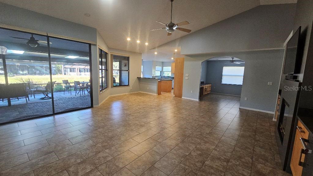 882 Lucas Lane Oldsmar, FL 34677 - Photo 6 of 27 a view of an entryway with a floor to ceiling window and wooden floor