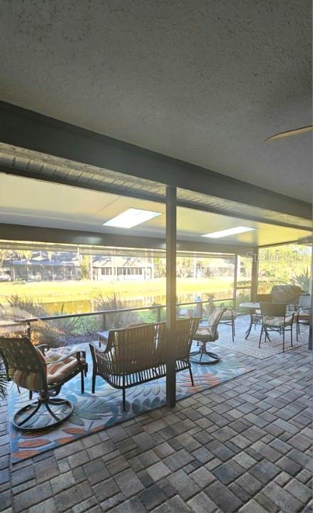 882 Lucas Lane Oldsmar, FL 34677 - Photo 9 of 27 a view of a swimming pool and outdoor seating