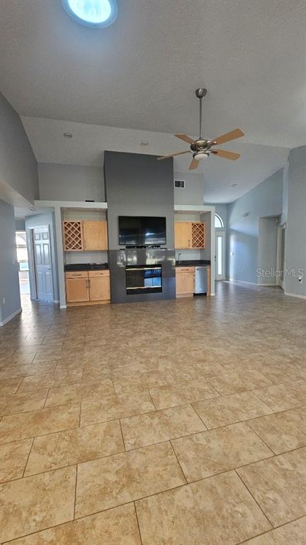 882 Lucas Lane Oldsmar, FL 34677 - Photo 10 of 27 a view of a livingroom with furniture and a flat screen tv