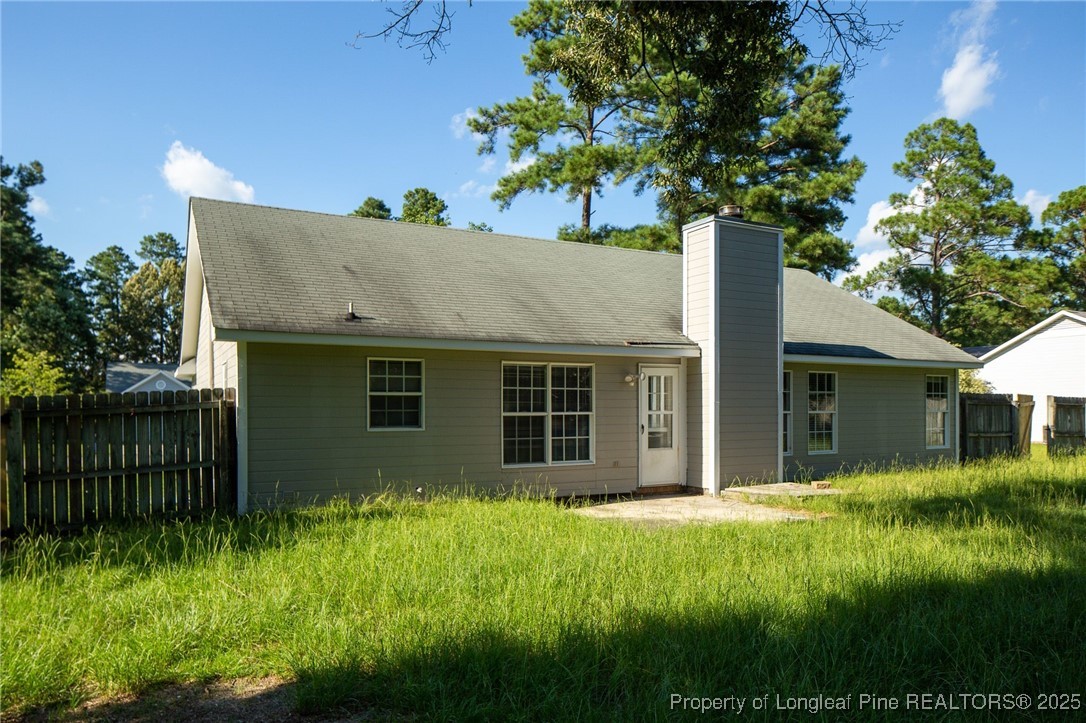 163 Independence Drive Raeford, NC 28376 - Photo 10 of 10 a house with a tree in front of it