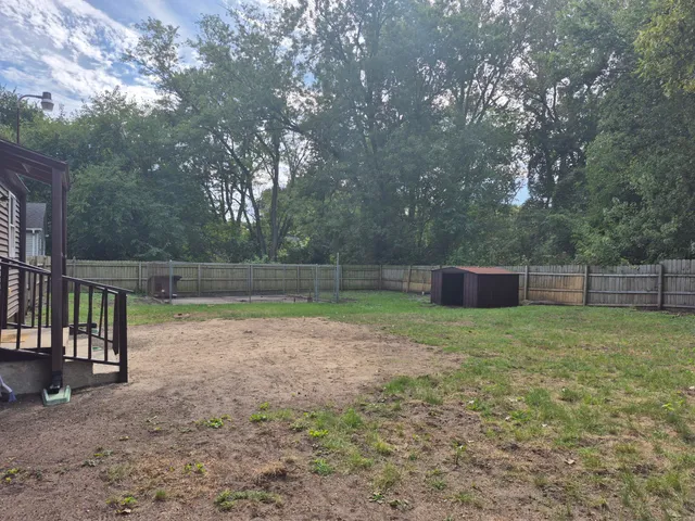 a backyard of a house with lots of green space