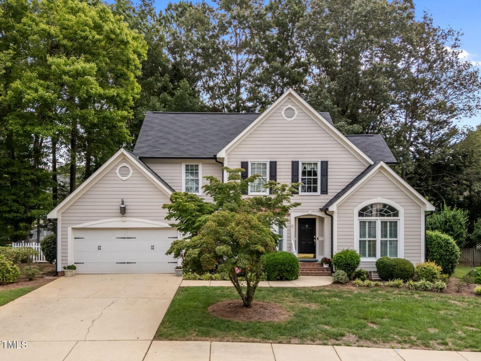 8516 Wheeling Drive Raleigh, NC 27615 - Photo 1 of 29 a view of house with yard and green space
