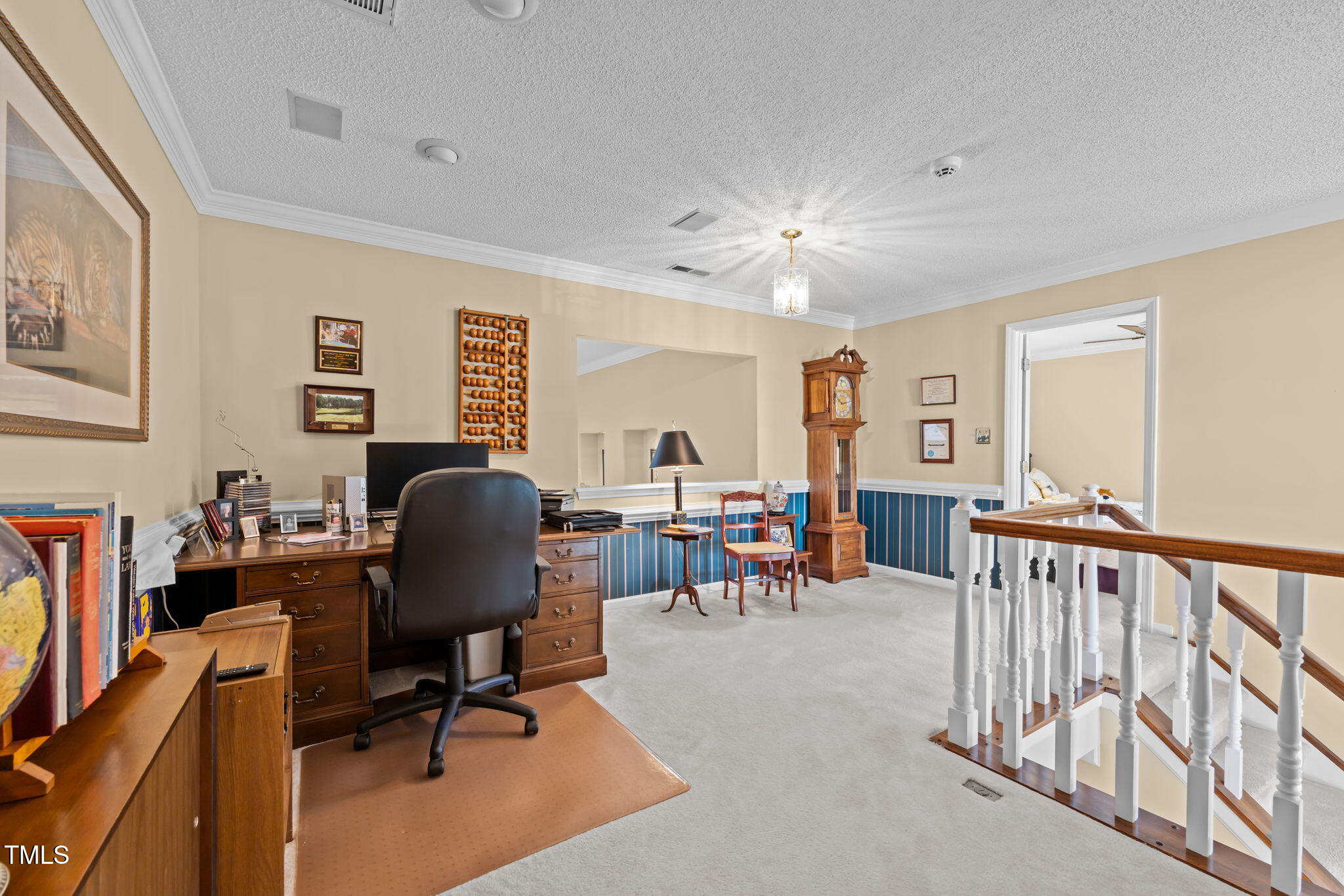8516 Wheeling Drive Raleigh, NC 27615 - Photo 15 of 29 a view of a livingroom with workspace and a couch