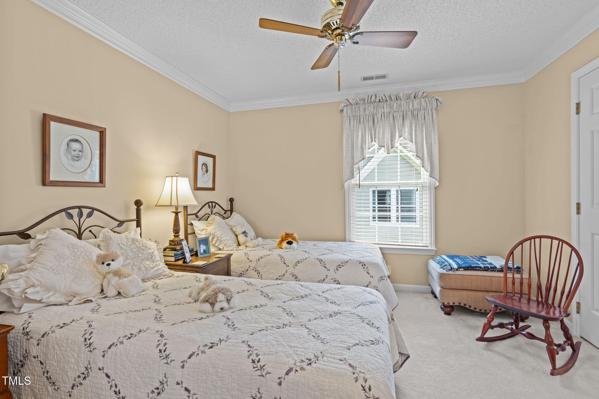 8516 Wheeling Drive Raleigh, NC 27615 - Photo 19 of 29 a bedroom with a bed a couch and dresser