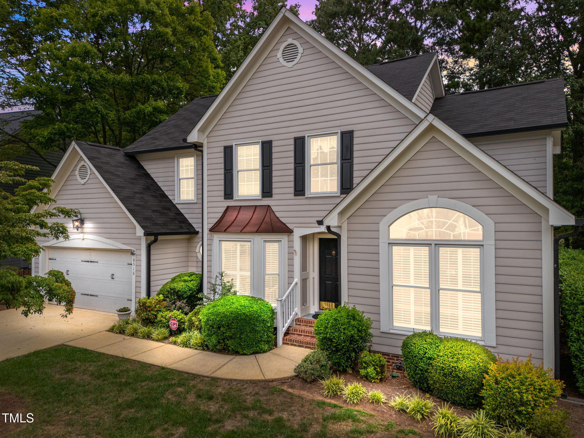 8516 Wheeling Drive Raleigh, NC 27615 - Photo 2 of 29 a front view of a house with a yard