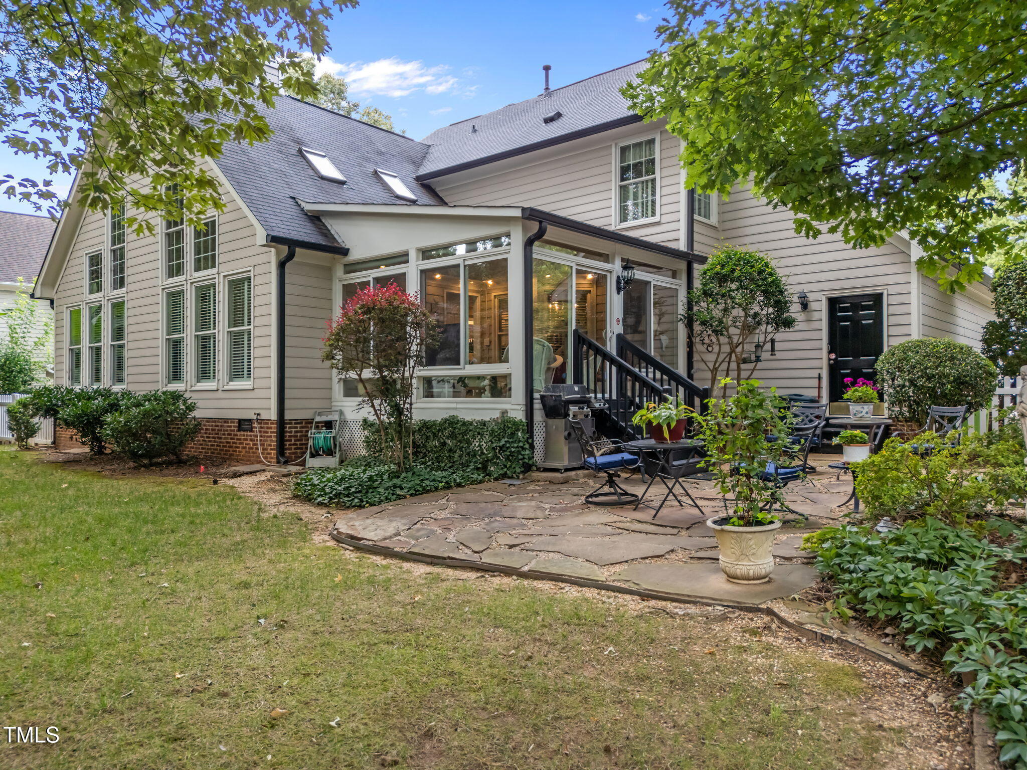 8516 Wheeling Drive Raleigh, NC 27615 - Photo 21 of 29 a view of a house with backyard and sitting area