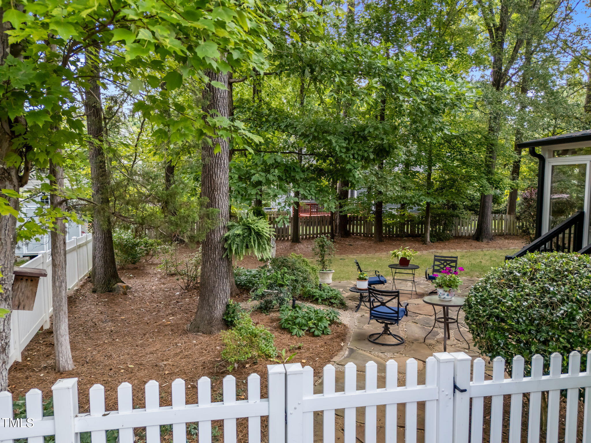8516 Wheeling Drive Raleigh, NC 27615 - Photo 22 of 29 a backyard of a house with lots of green space