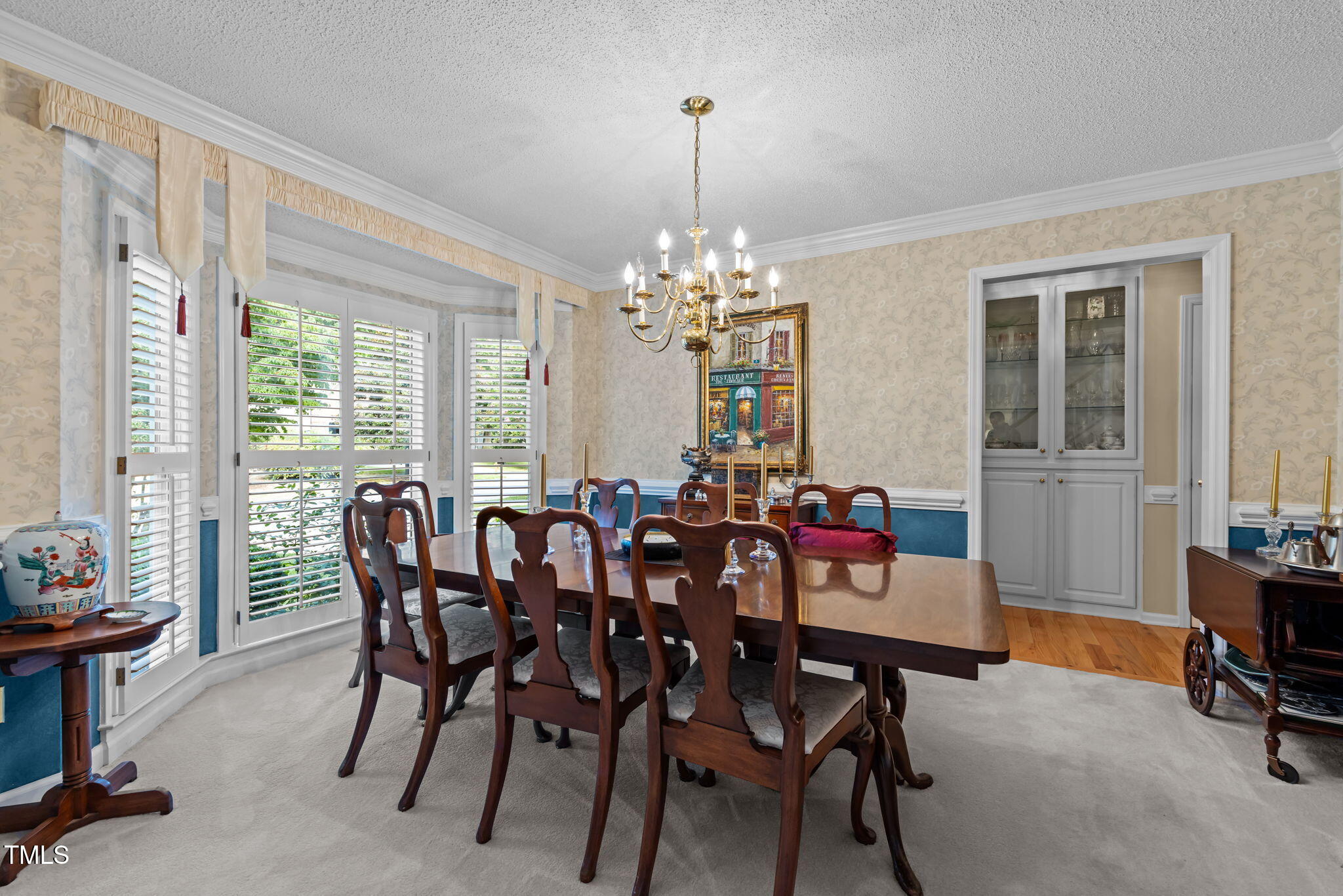 8516 Wheeling Drive Raleigh, NC 27615 - Photo 4 of 29 a view of a dining room with furniture and window
