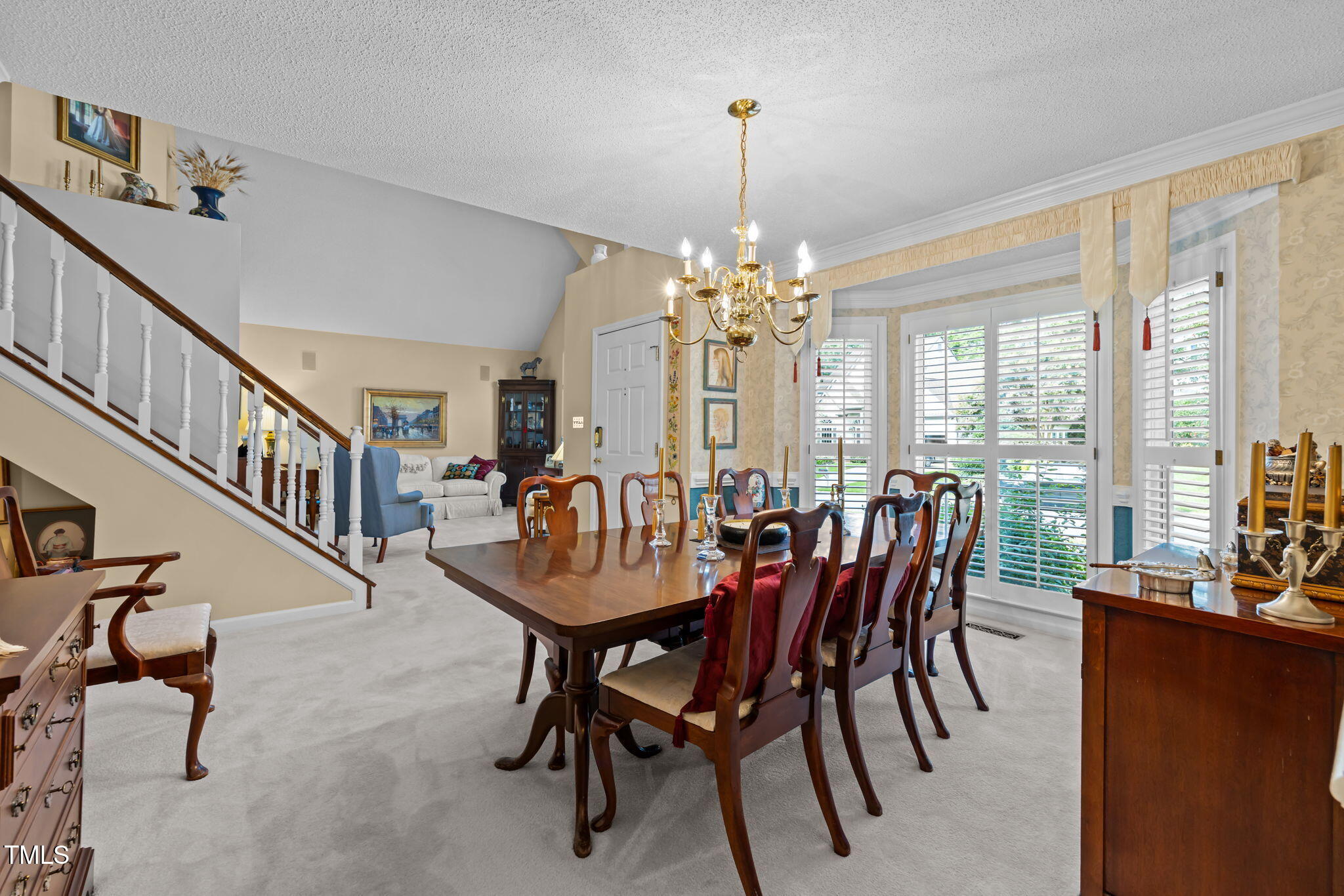 8516 Wheeling Drive Raleigh, NC 27615 - Photo 5 of 29 a view of a dining room with furniture window and wooden floor