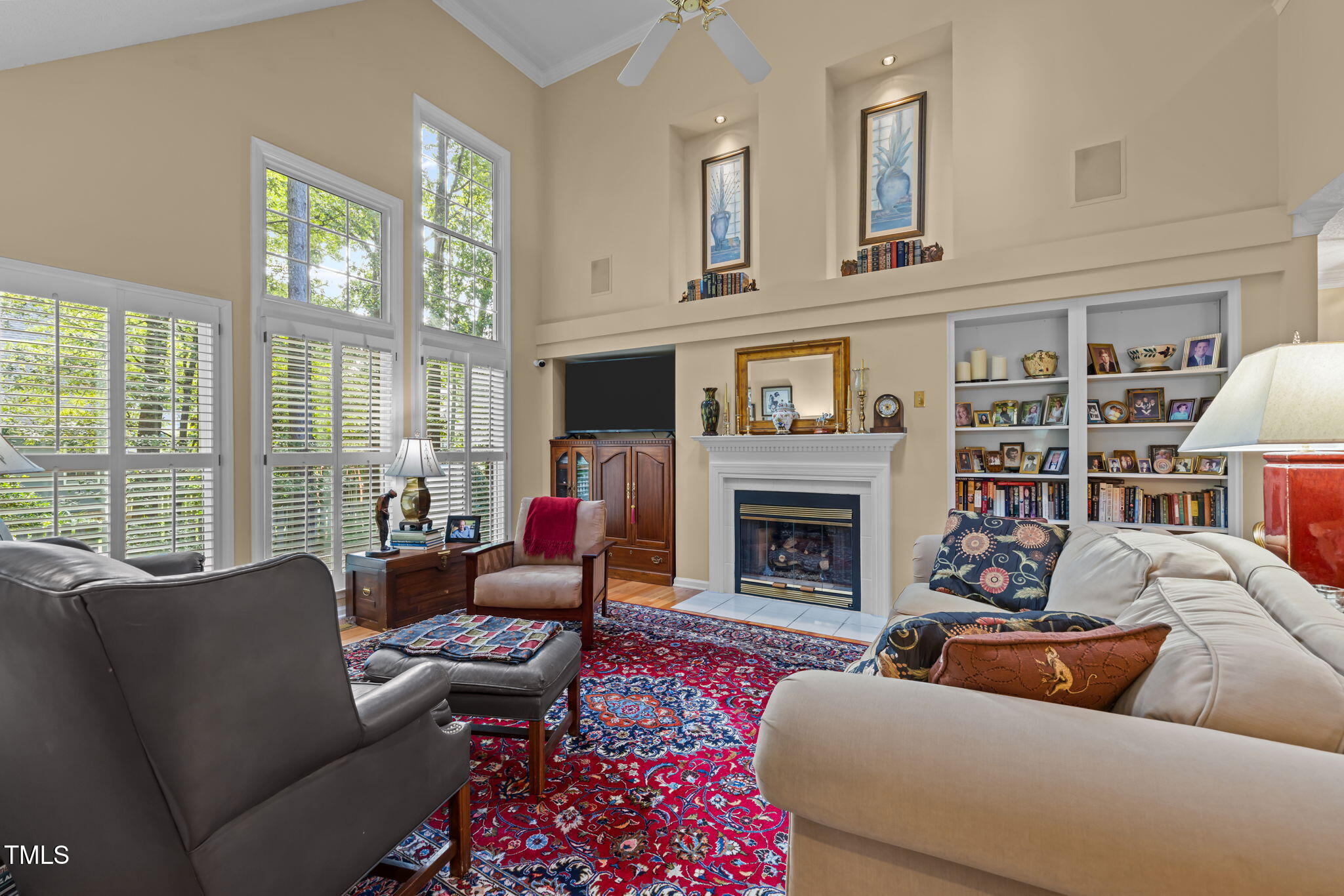 8516 Wheeling Drive Raleigh, NC 27615 - Photo 6 of 29 a living room with furniture fireplace and a large window