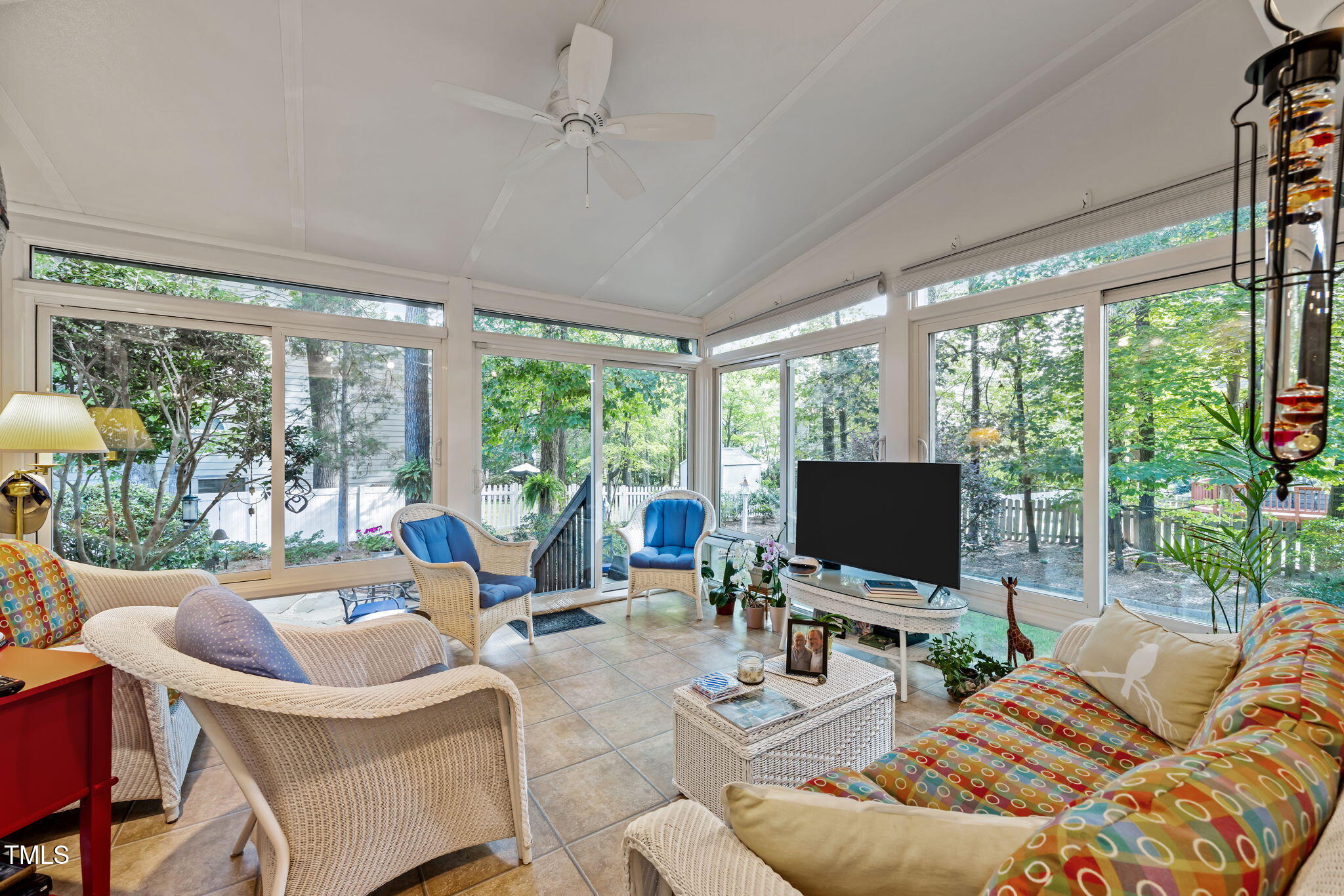 8516 Wheeling Drive Raleigh, NC 27615 - Photo 7 of 29 a living room with furniture and a flat screen tv
