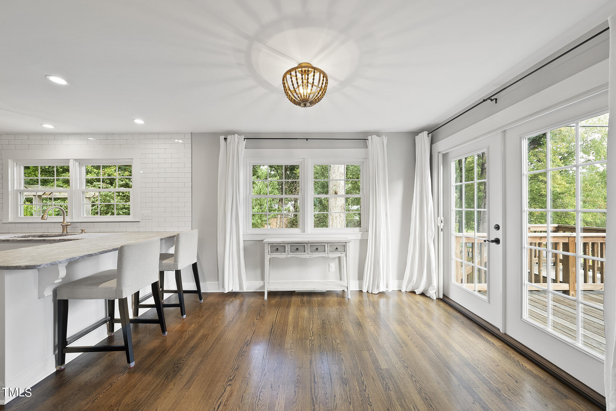 4900 Latimer Road Raleigh, NC 27609 - Photo 13 of 46 a view of an empty room with a window and wooden floor
