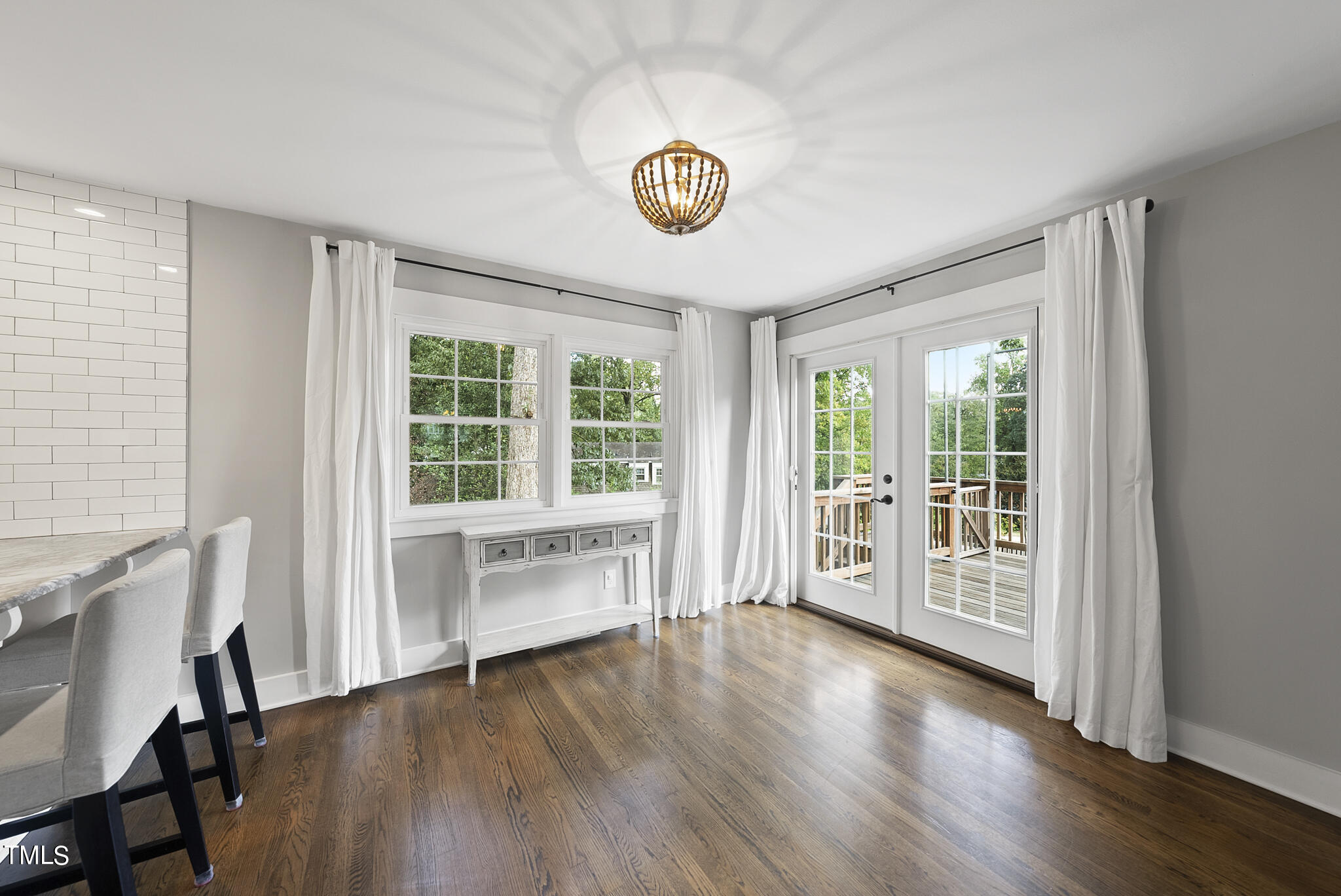 4900 Latimer Road Raleigh, NC 27609 - Photo 14 of 46 a view of an empty room with a window and wooden floor