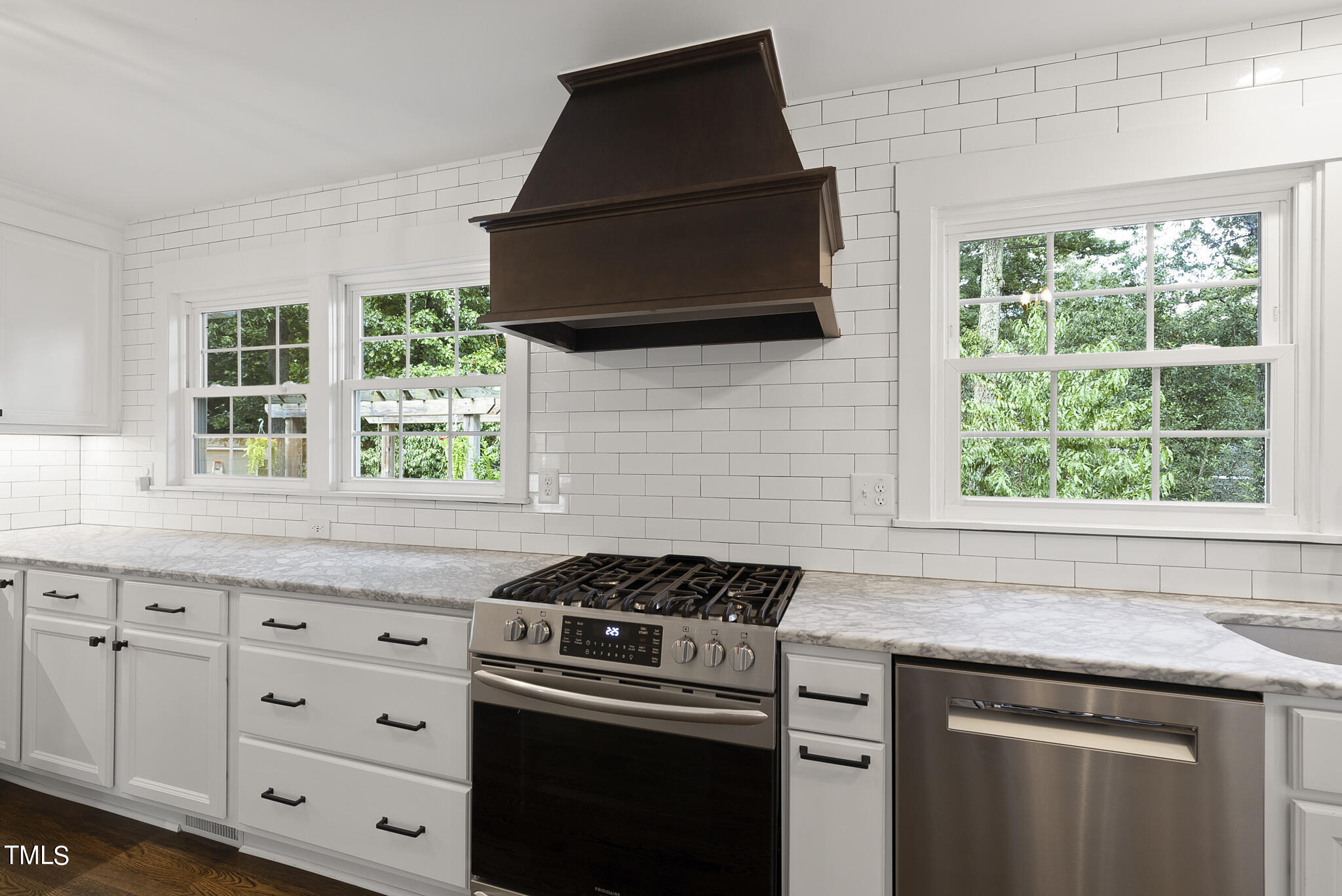 4900 Latimer Road Raleigh, NC 27609 - Photo 18 of 46 a kitchen with granite countertop a stove and a microwave