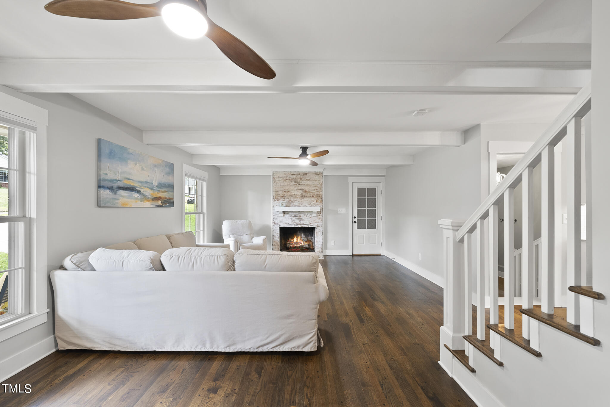 4900 Latimer Road Raleigh, NC 27609 - Photo 24 of 46 a living room with fireplace furniture and a wooden floor