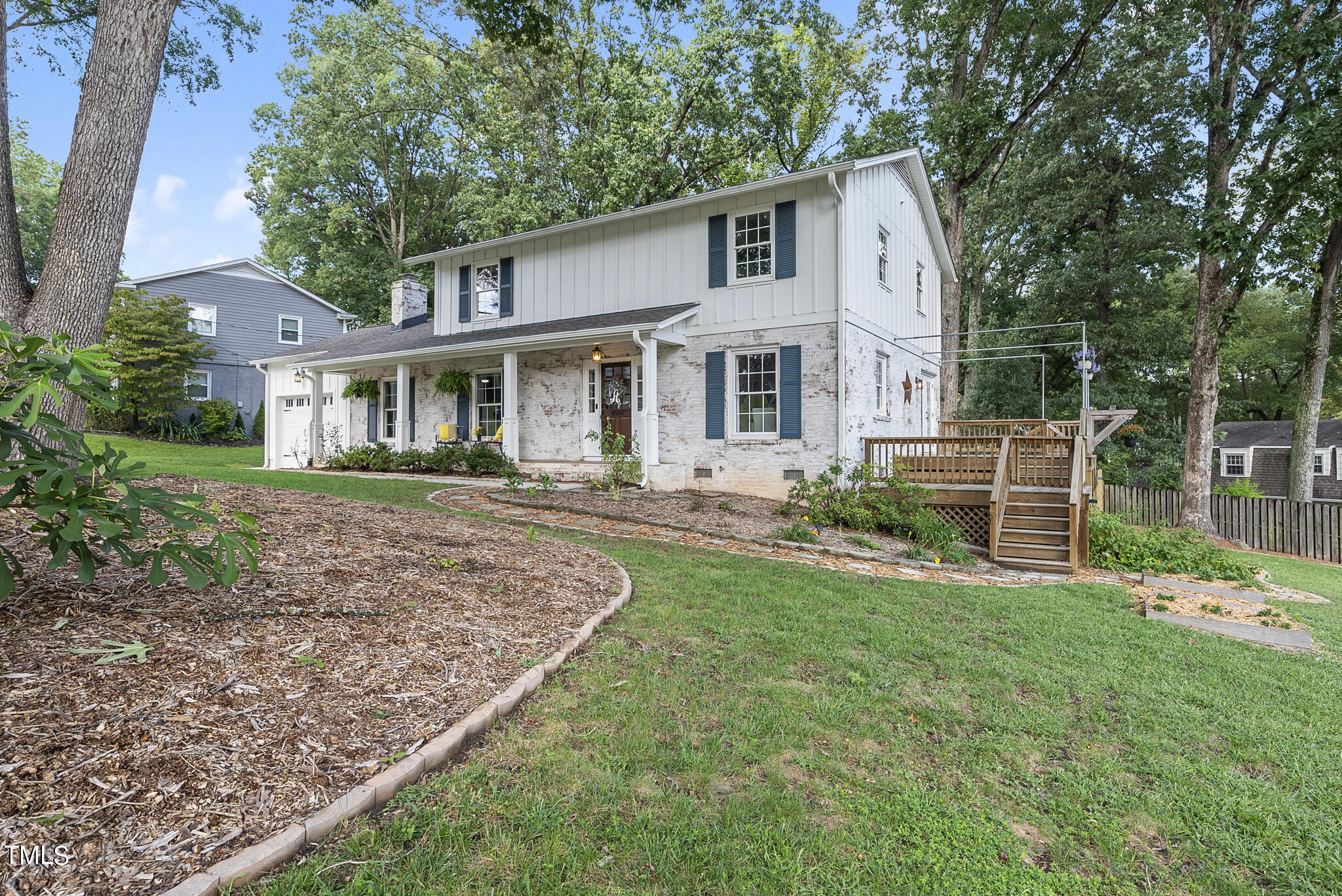 4900 Latimer Road Raleigh, NC 27609 - Photo 3 of 46 a front view of a house with a yard
