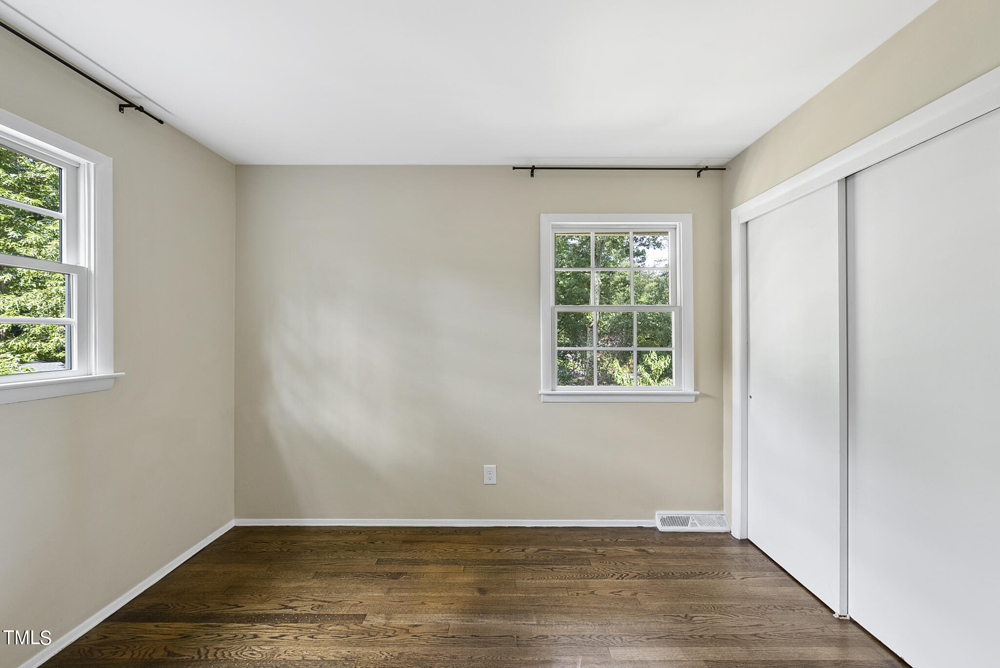 4900 Latimer Road Raleigh, NC 27609 - Photo 38 of 46 an empty room with wooden floor and windows
