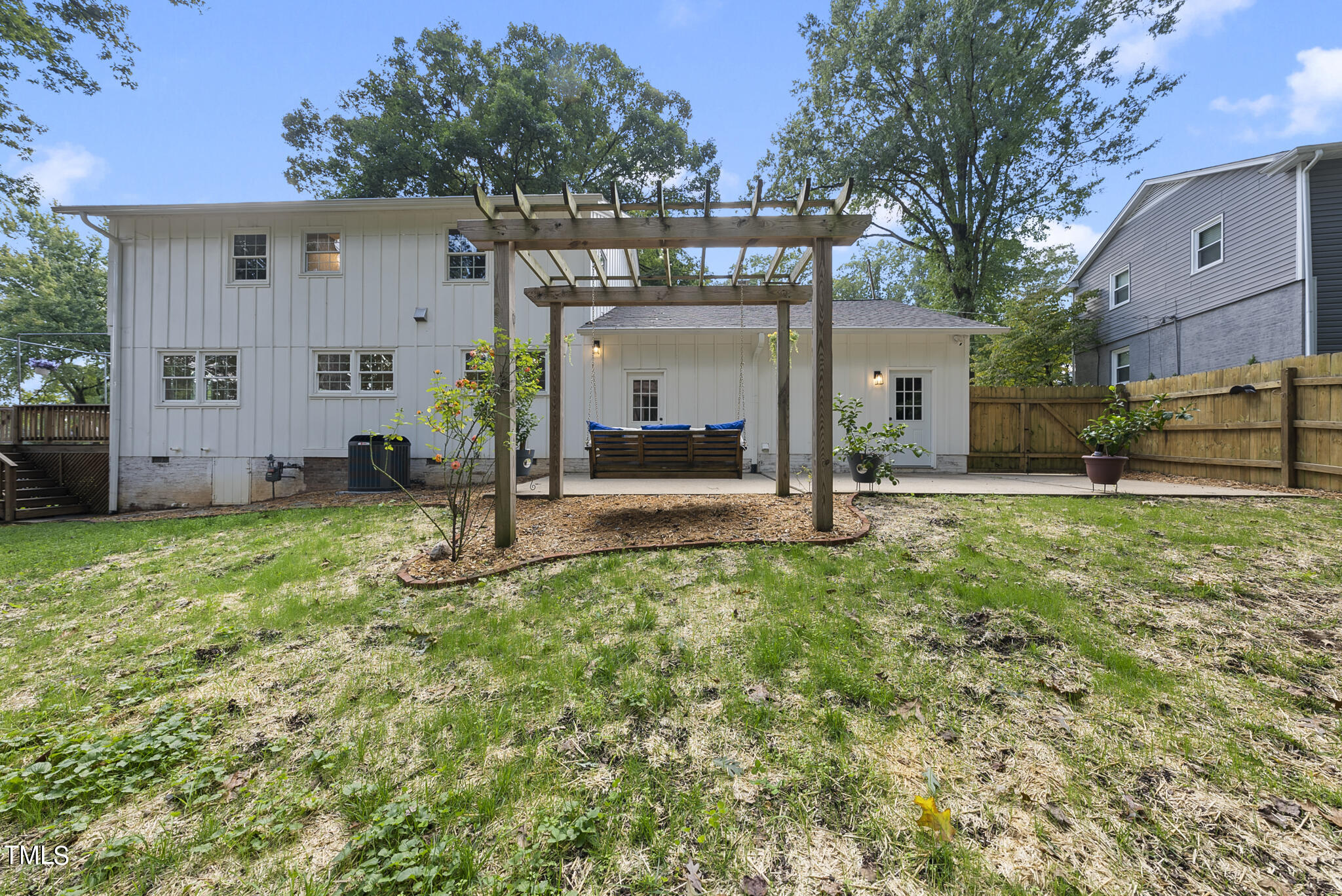 4900 Latimer Road Raleigh, NC 27609 - Photo 40 of 46 a view of a house with backyard and a tree