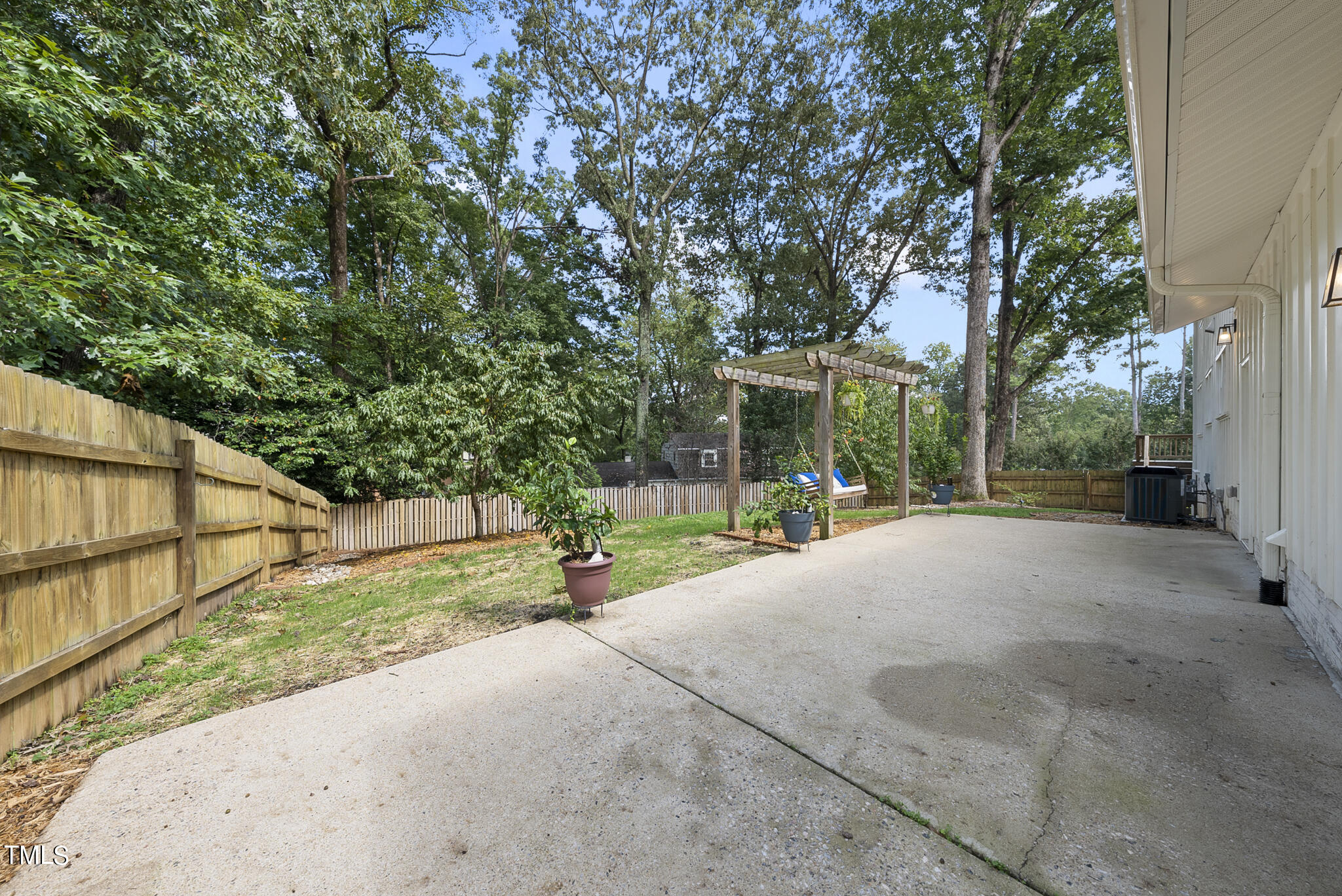 4900 Latimer Road Raleigh, NC 27609 - Photo 41 of 46 a view of a house with backyard and trees