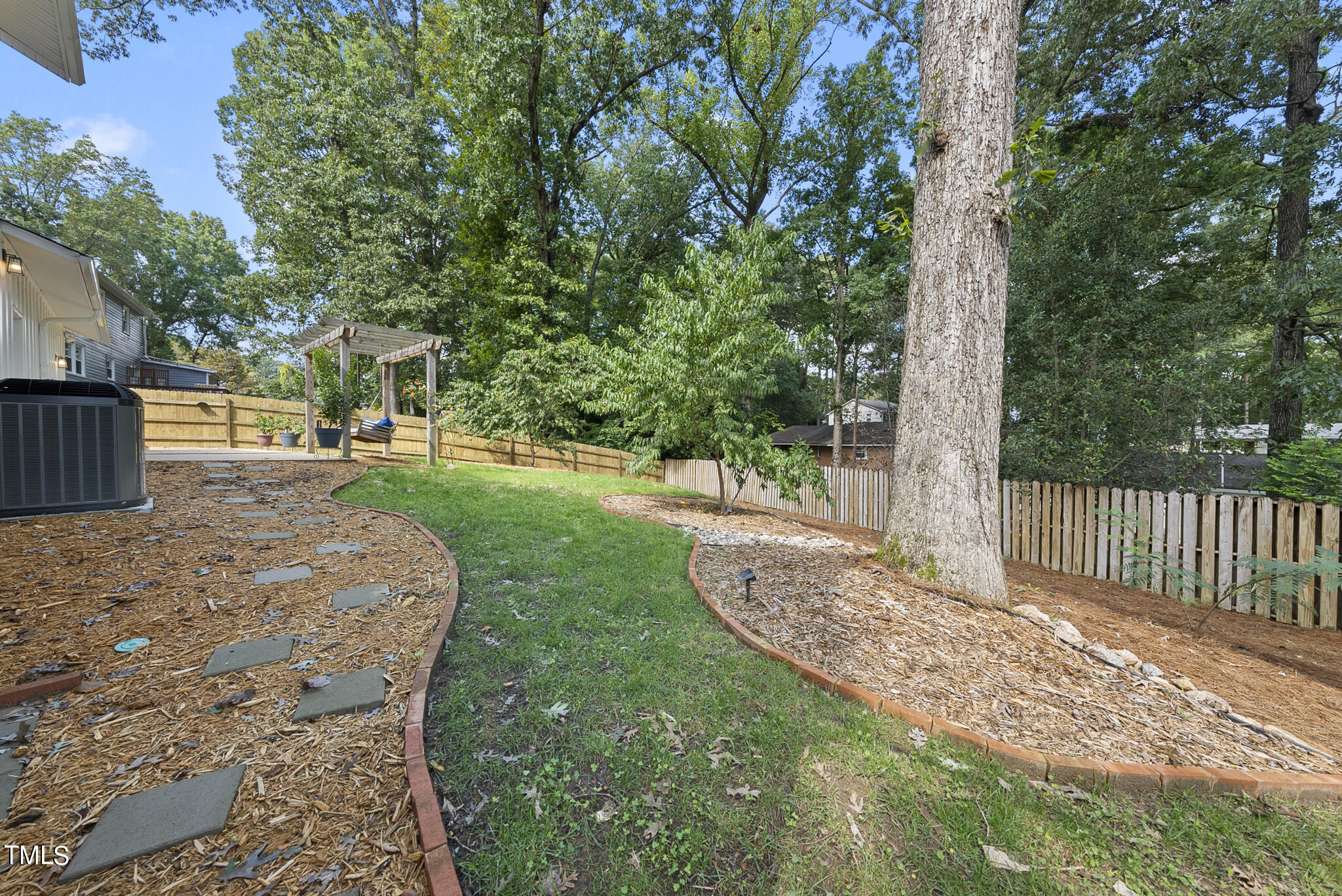 4900 Latimer Road Raleigh, NC 27609 - Photo 43 of 46 a view of a backyard with a garden