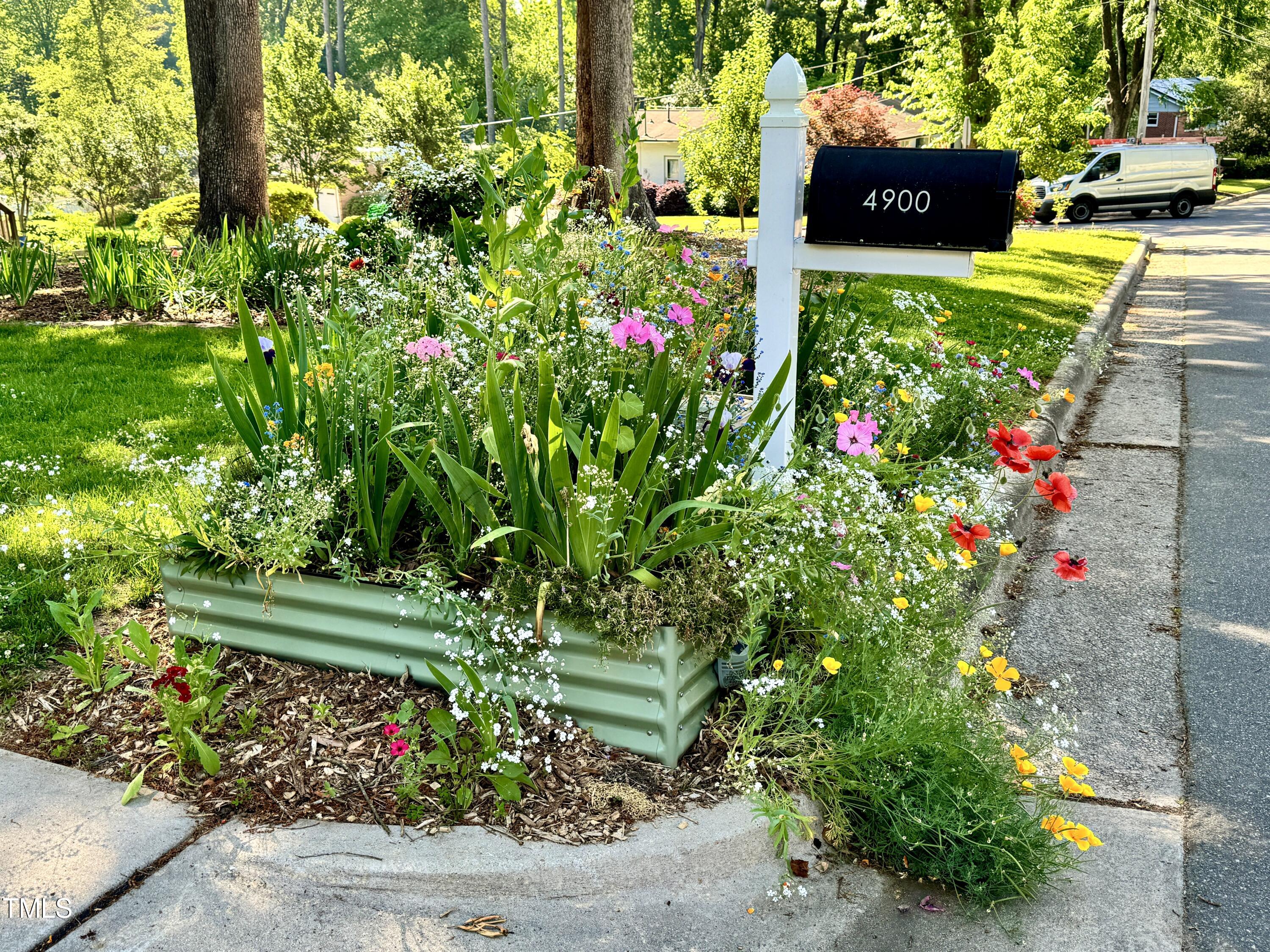 4900 Latimer Road Raleigh, NC 27609 - Photo 44 of 46 a view of a sign in front of flowers