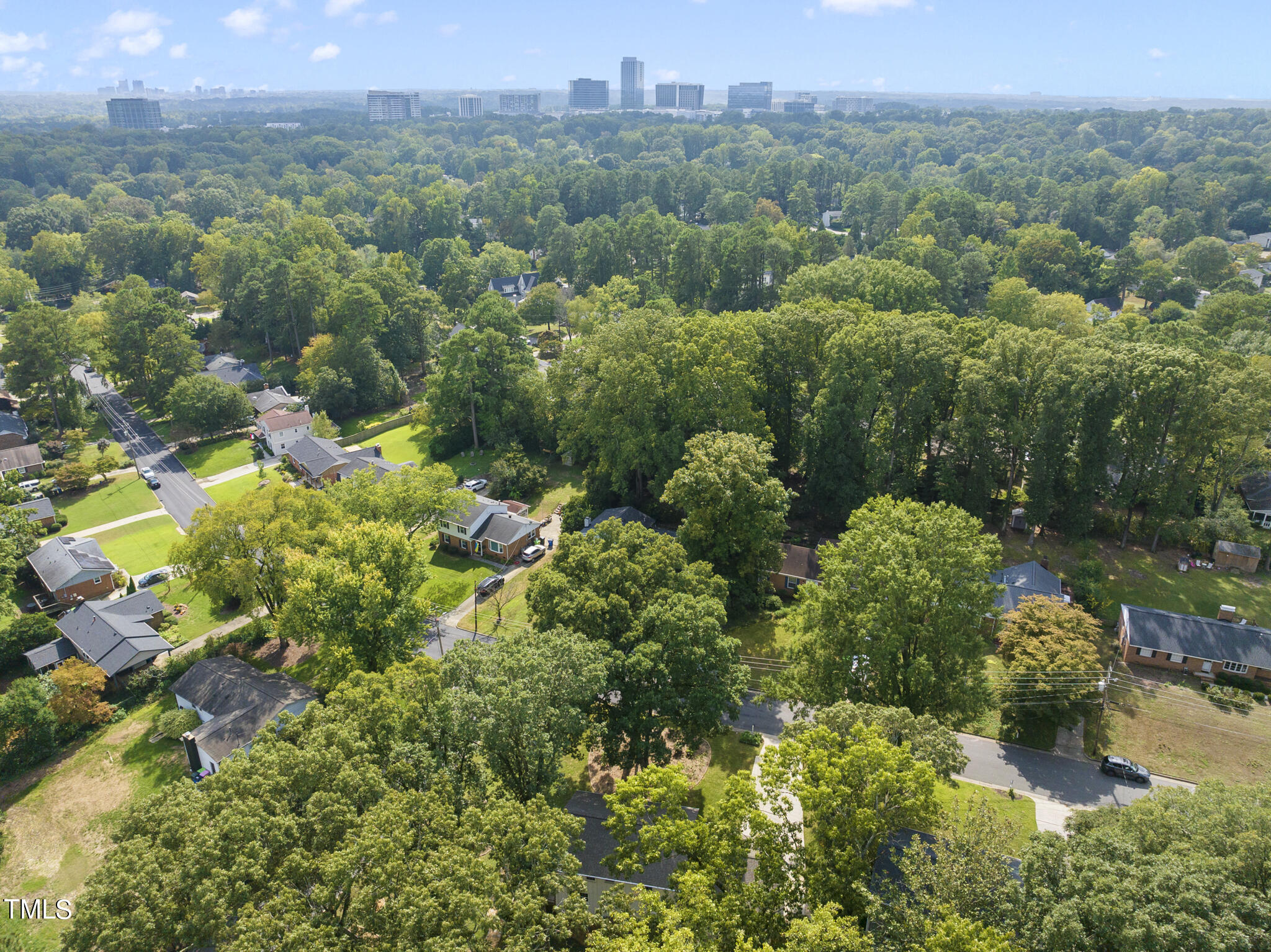 4900 Latimer Road Raleigh, NC 27609 - Photo 46 of 46 an aerial view of a houses with a yard and lake