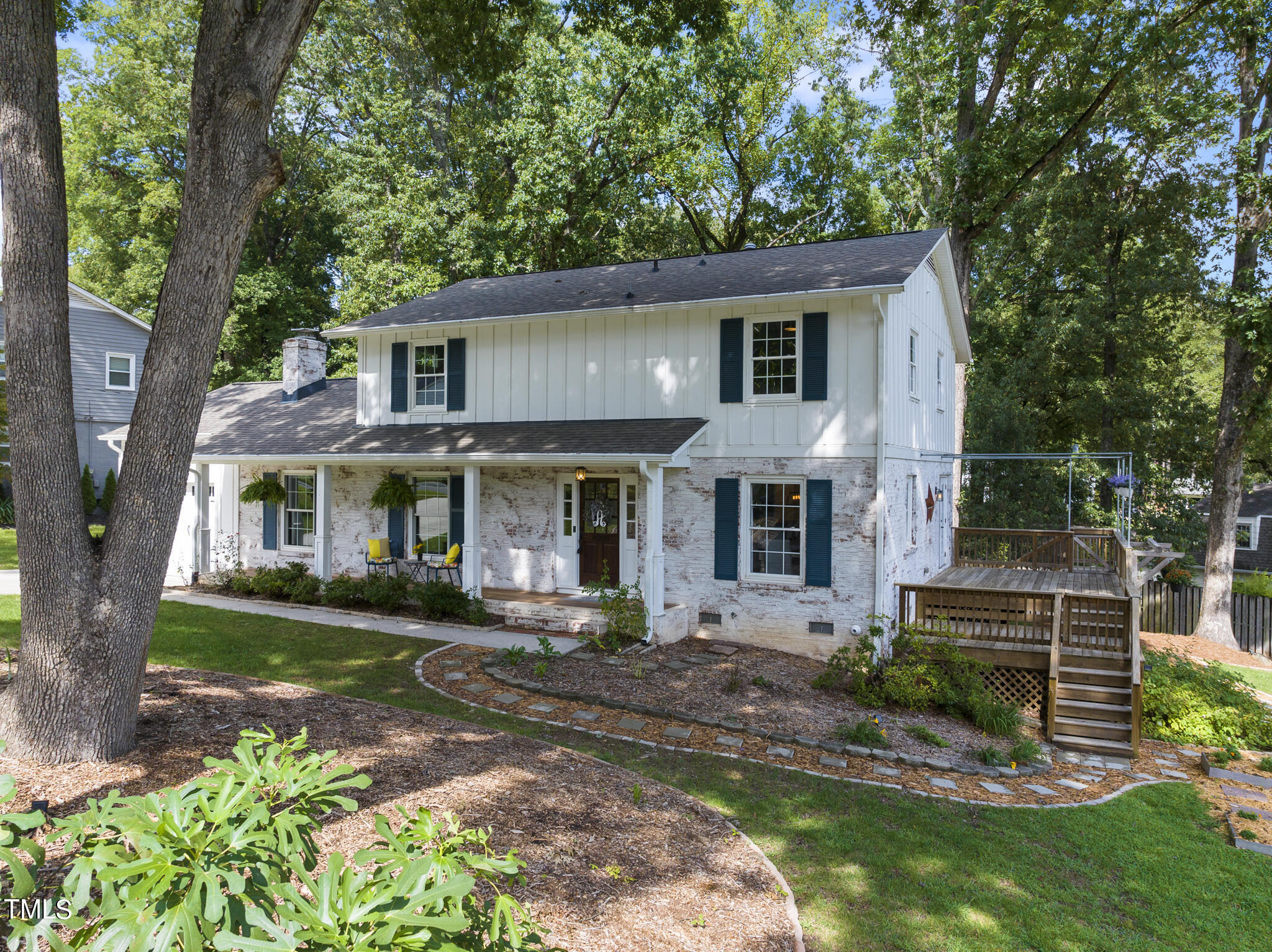 4900 Latimer Road Raleigh, NC 27609 - Photo 5 of 46 a front view of a house with garden