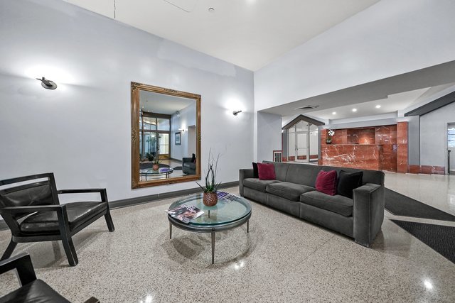 1212 North LaSalle Drive, Unit 1603 Chicago, IL 60610 - Photo 14 of 14 a living room with furniture and a wooden floor