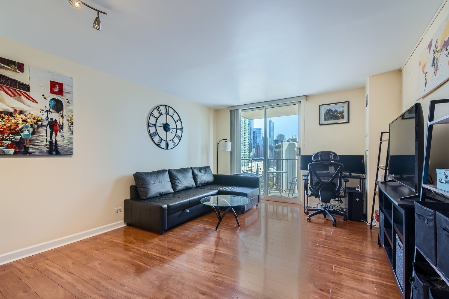1212 North LaSalle Drive, Unit 1603 Chicago, IL 60610 - Photo 3 of 14 a living room with furniture and a flat screen tv