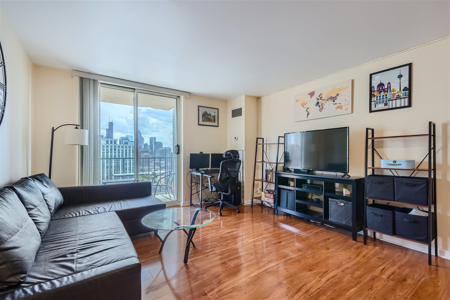 1212 North LaSalle Drive, Unit 1603 Chicago, IL 60610 - Photo 4 of 14 a living room with furniture and a flat screen tv
