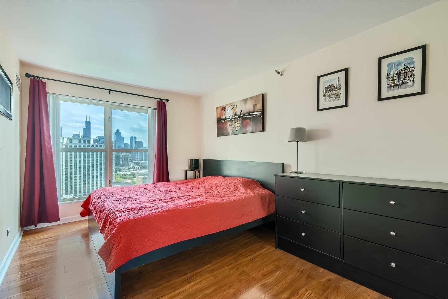 1212 North LaSalle Drive, Unit 1603 Chicago, IL 60610 - Photo 7 of 14 a bedroom with a bed and a window