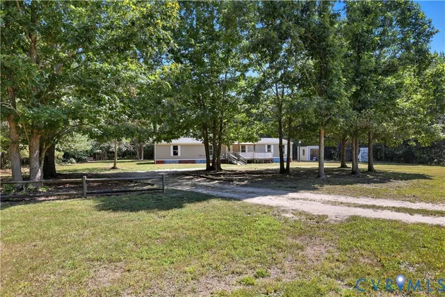 a view of a town with large trees
