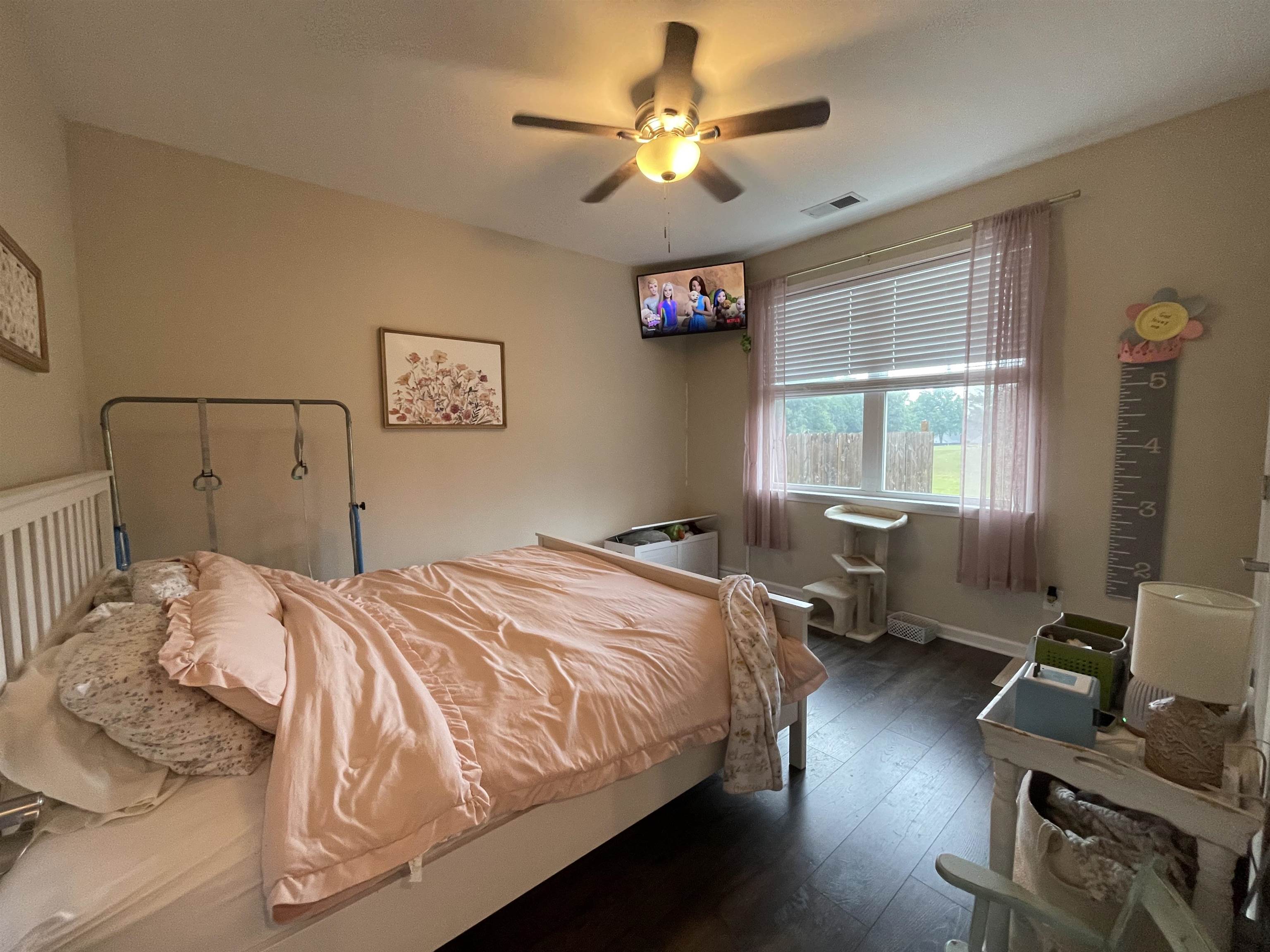 378 Holly Grove Road Covington, TN 38019 - Photo 18 of 23 a bedroom with a bed couch and a window