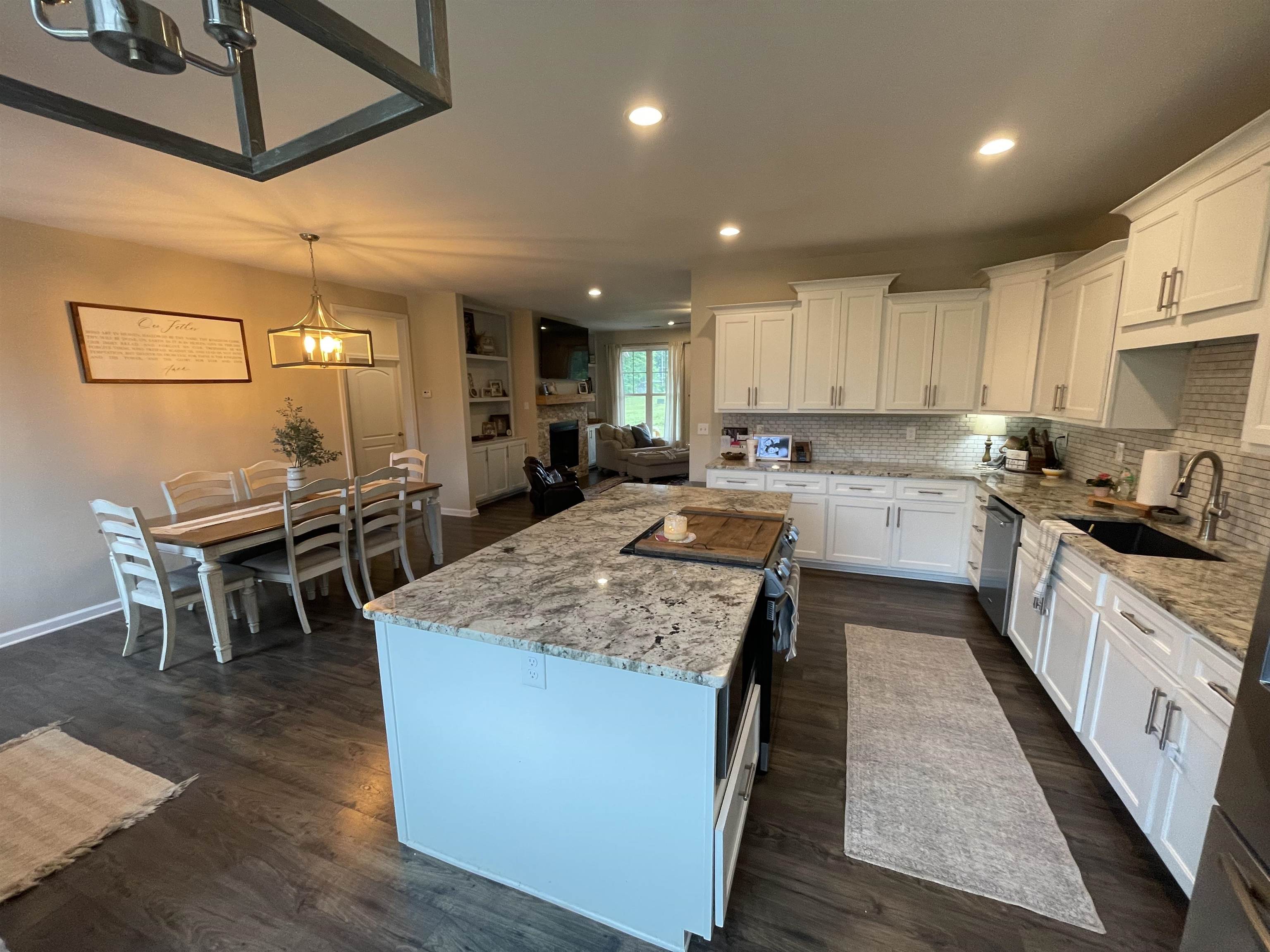 378 Holly Grove Road Covington, TN 38019 - Photo 6 of 23 a kitchen with sink and chairs