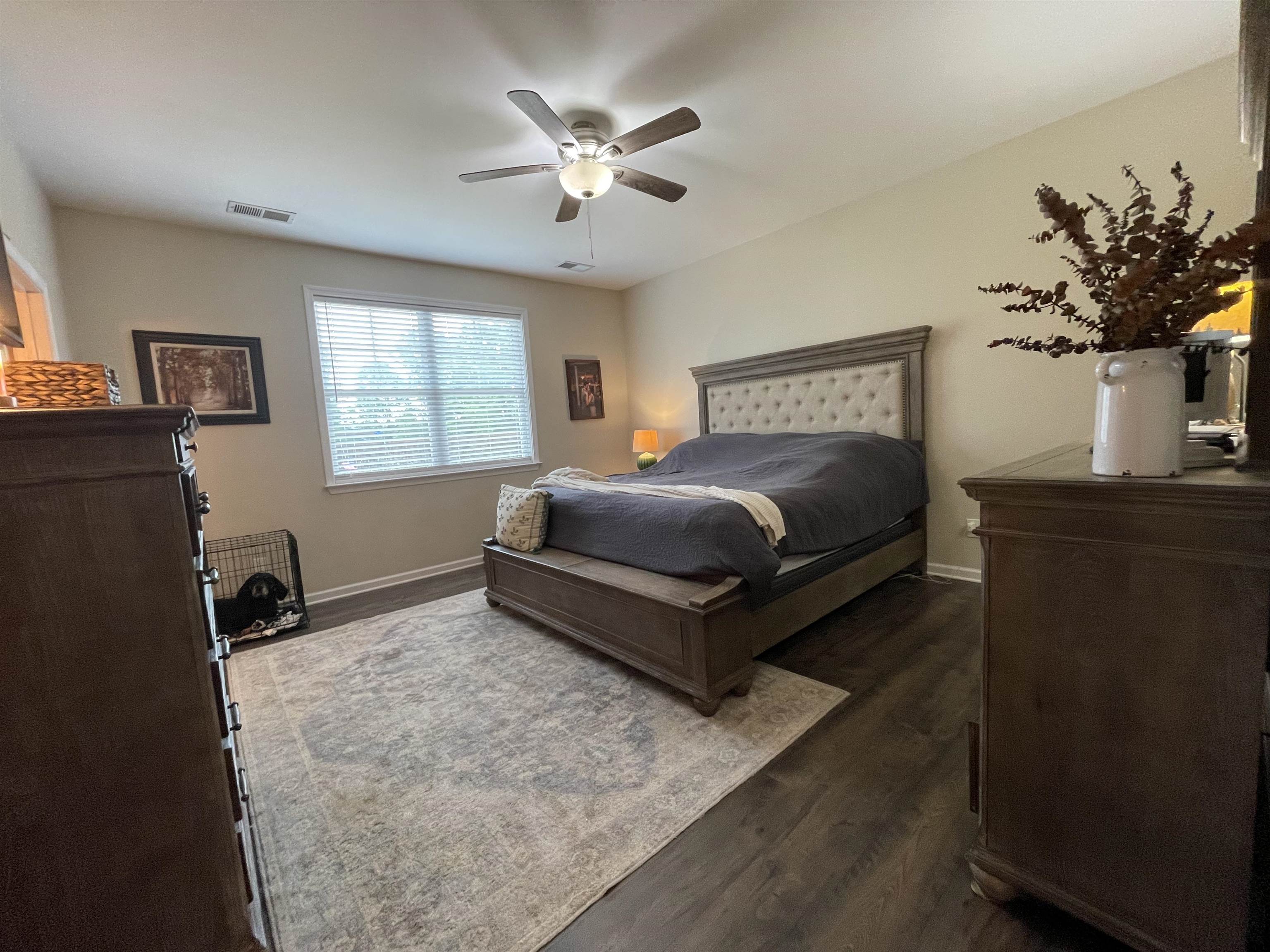 378 Holly Grove Road Covington, TN 38019 - Photo 10 of 23 a spacious bedroom with a bed and a couch