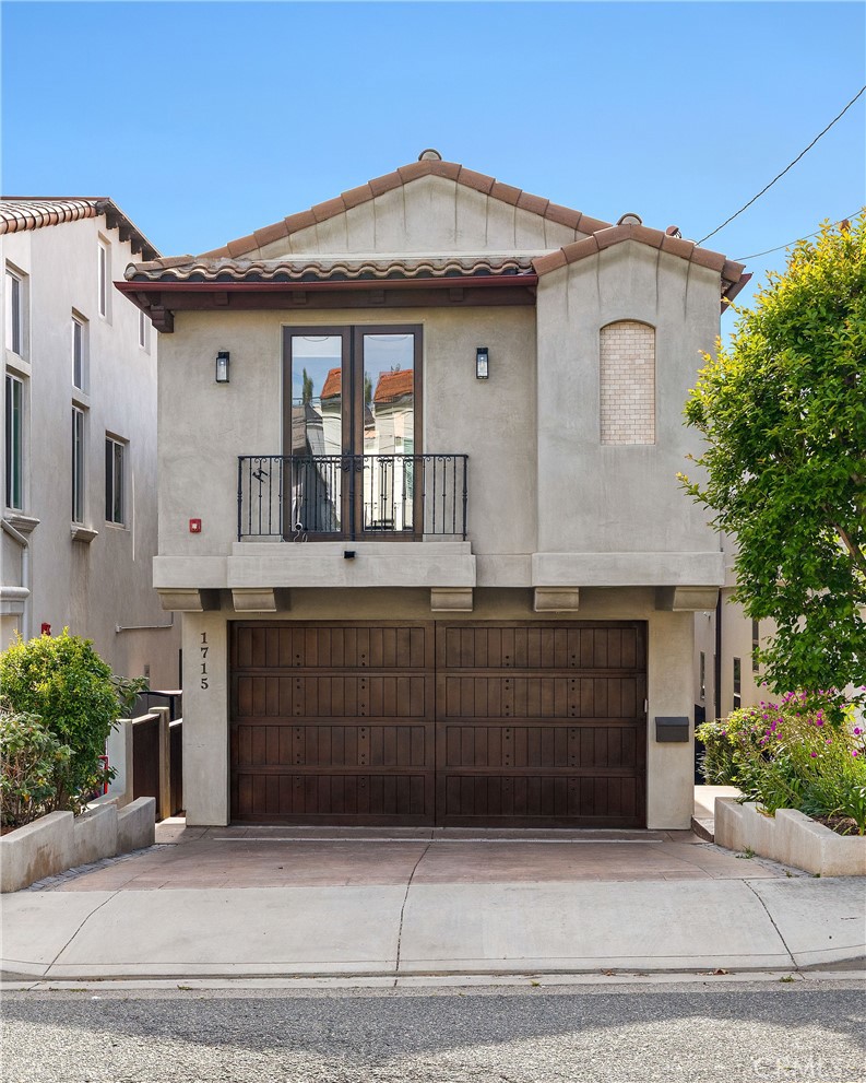 a front view of a house with a garage