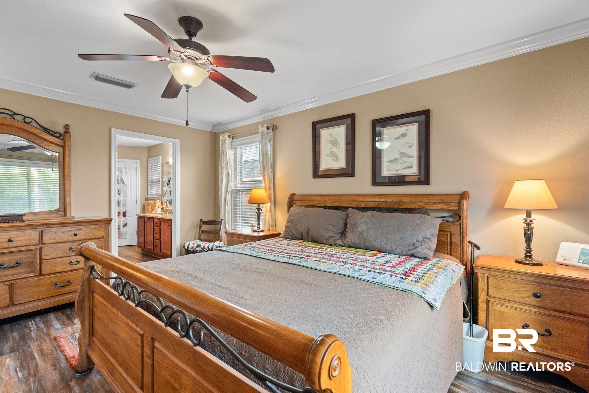 562 Vestige Mews Foley, AL 36535 - Photo 24 of 54 Spacious bedroom featuring wood-finish flooring, a ceiling fan with integrated lighting, and crown molding
