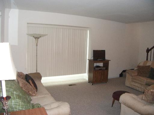 2089 Kettering Road Hoffman Estates, IL 60169 - Photo 3 of 14 a living room with furniture and a flat screen tv