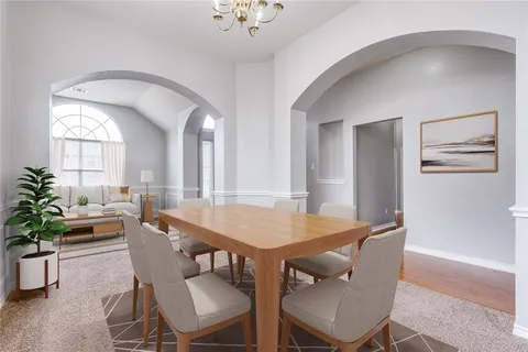 a dining room with furniture and window