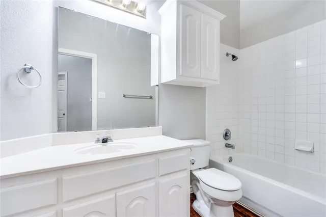 a bathroom with a sink a toilet and a bathtub